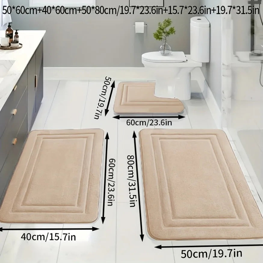 Three-piece PVC bathroom floor mat set in grey with striped and grid patterns on tiled floor