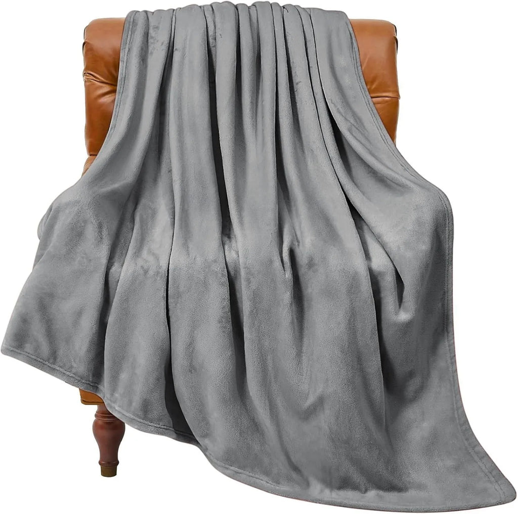 Light grey polyester coral flannel blanket for office naps and air conditioning, shown in a solid colour