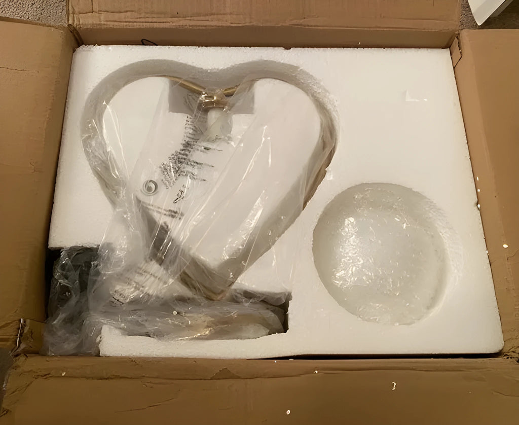 Gold metal base heart-shaped table lamp with clear crystal-cut acrylic shade