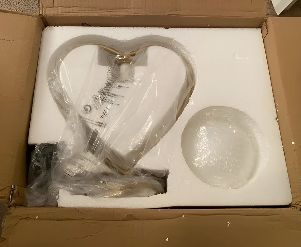 Gold metal base heart-shaped table lamp with clear crystal-cut acrylic shade