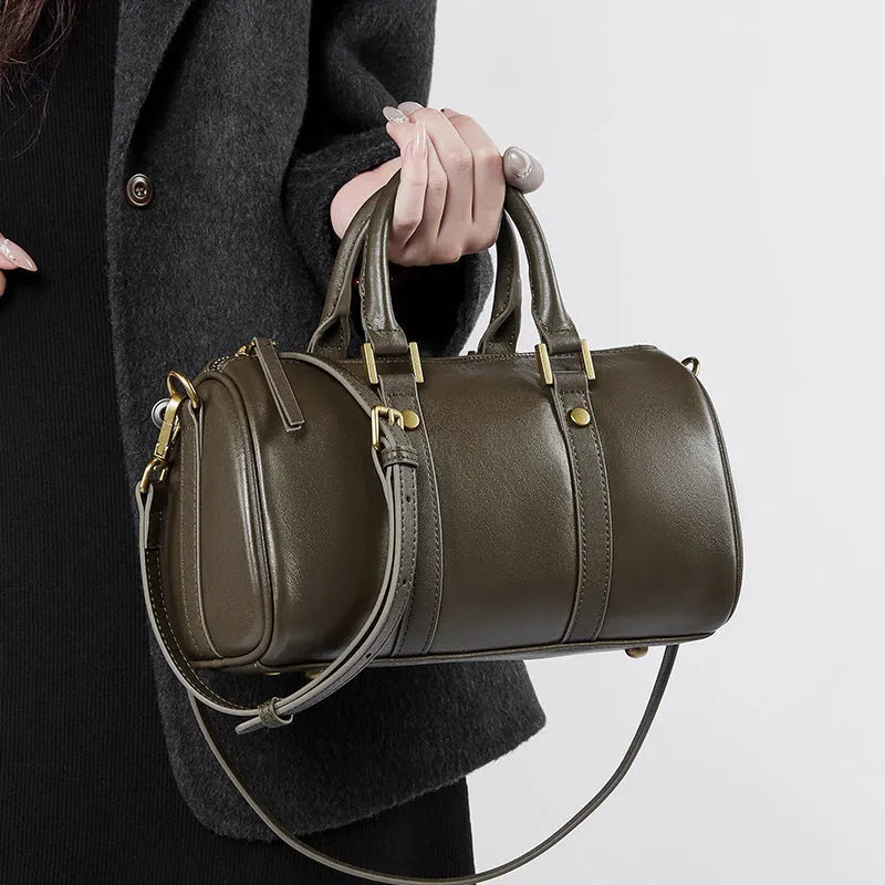 Retro portable cowhide crossbody bag in pillow shape with sewing thread detail, black colour