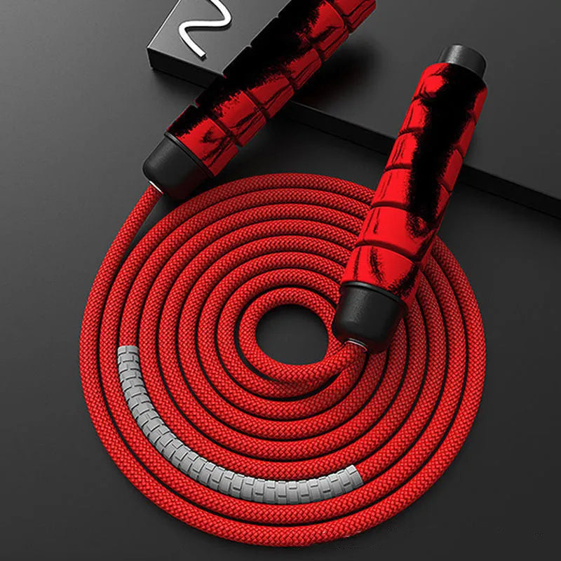 Red and grey skipping rope with 2.8m polyester rope, 16cm handles, and 4cm handle diameter.