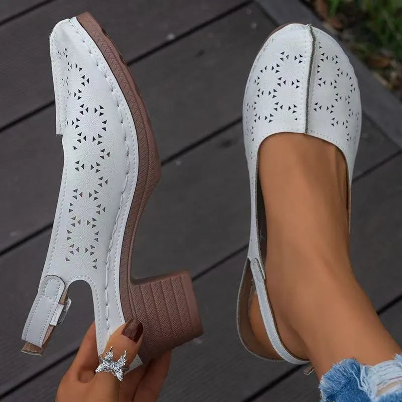 Women's black closed toe wedge sandals with round toe and rubber sole on a white background.