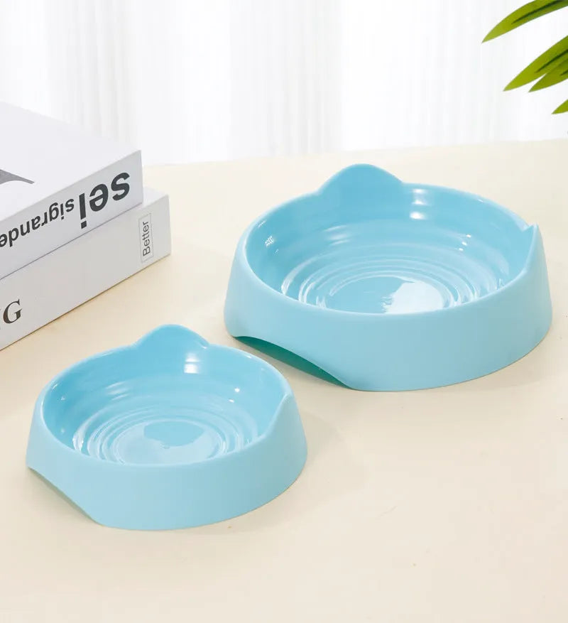 Blue ceramic dog slow feeder bowl with internal maze pattern for small, medium, and large breed puppies.