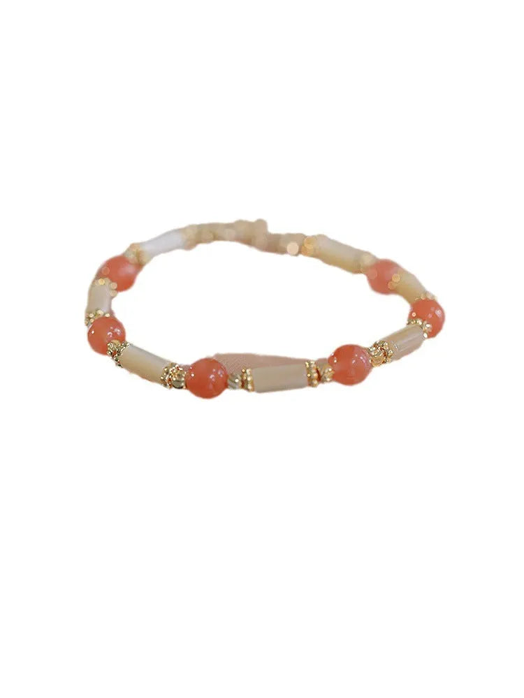 Hetian jade bamboo joint bracelet 6mm bead size on display against neutral background