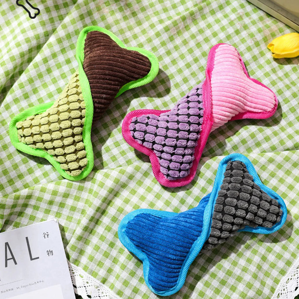 Blue teddy dog toy with a bone model and corn fleece lining for bite-resistant play.
