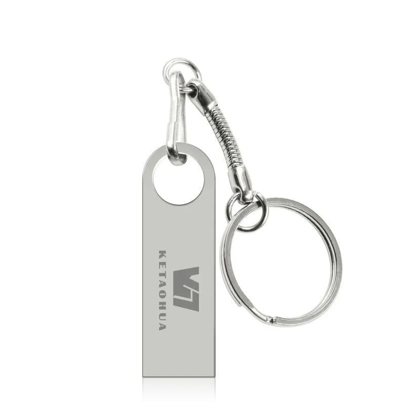 Metal car-shaped USB flash drive in silver finish showing detailed automotive design and USB connector