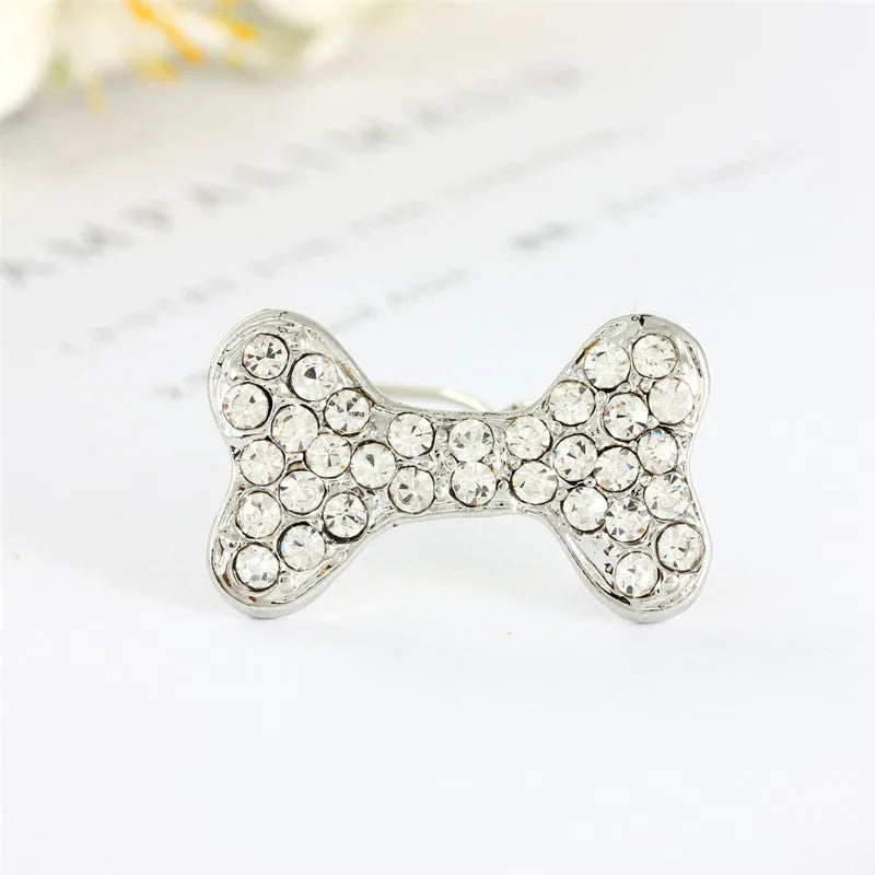 Rhinestone dog bone hair clip in alloy, shown in white, pink, blue, red and purple colour options.
