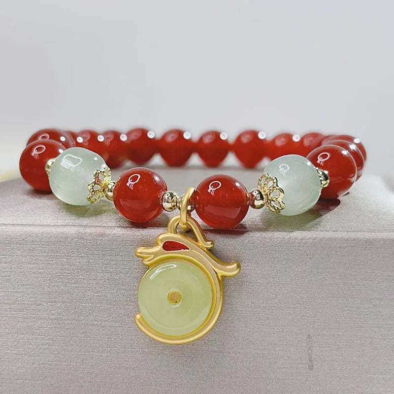 Handmade red agate bracelet with Chinese dragon design for women.