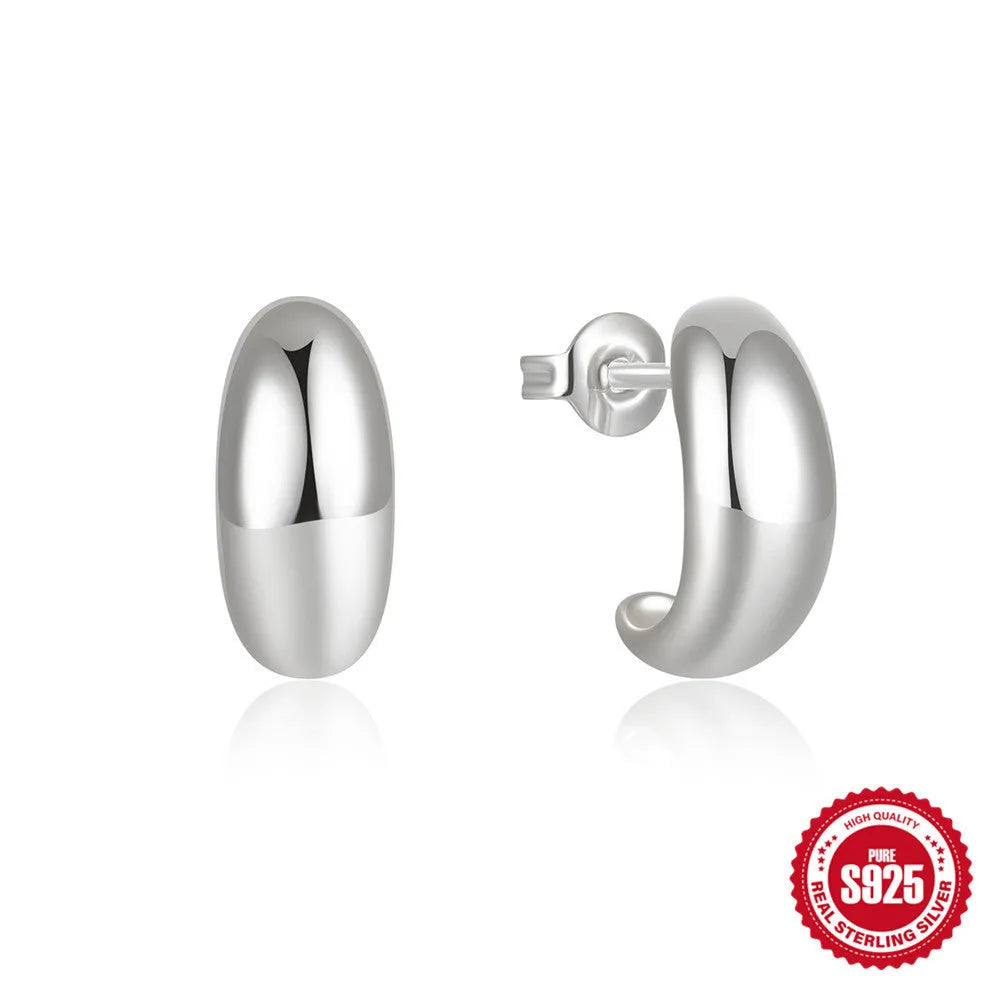 A pair of simple C-shaped ring stud earrings in 925 sterling silver, shown in both gold and silver colour options.
